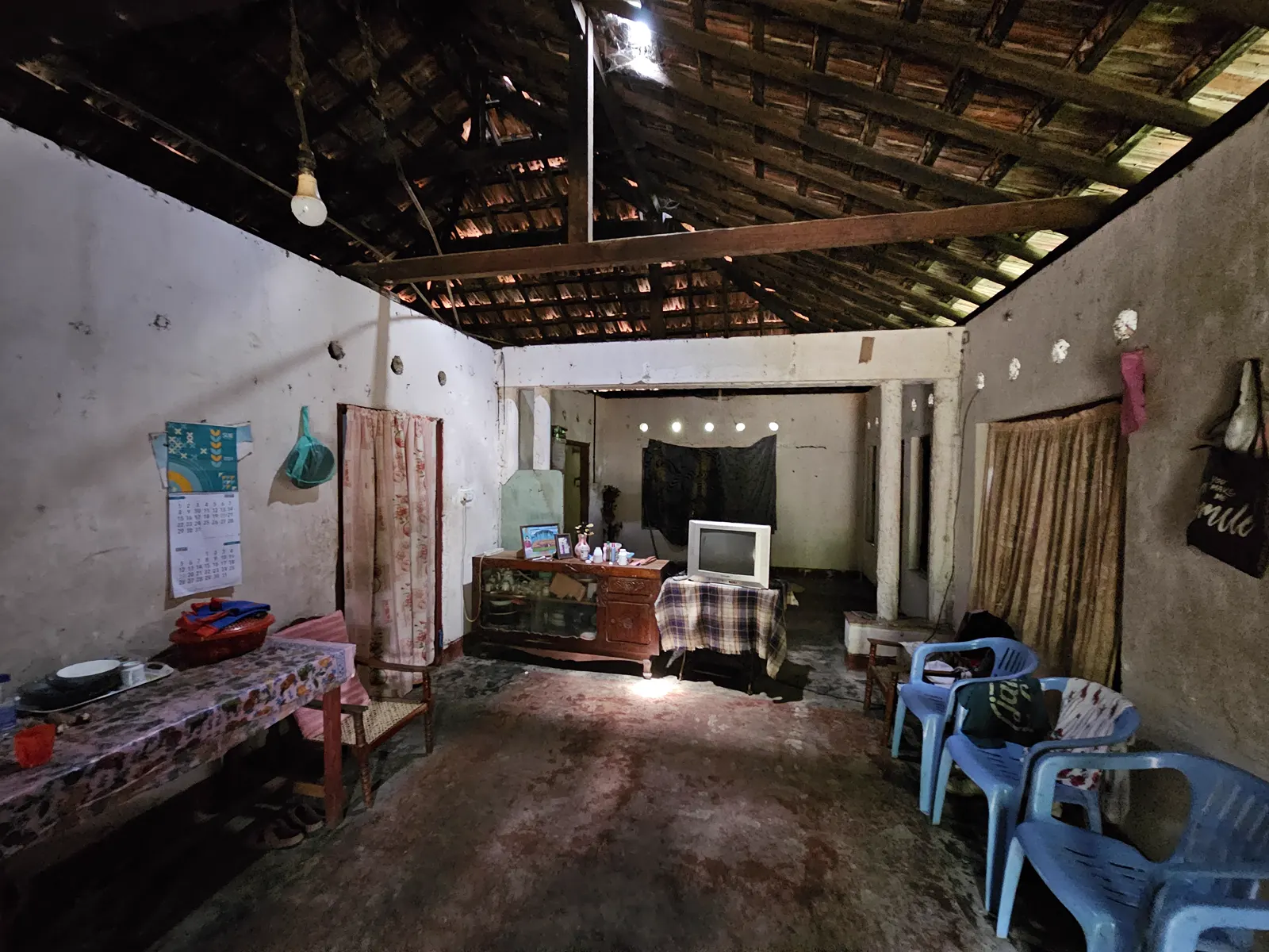 Damaged interior and roof of the original house before boutique hotel renovation