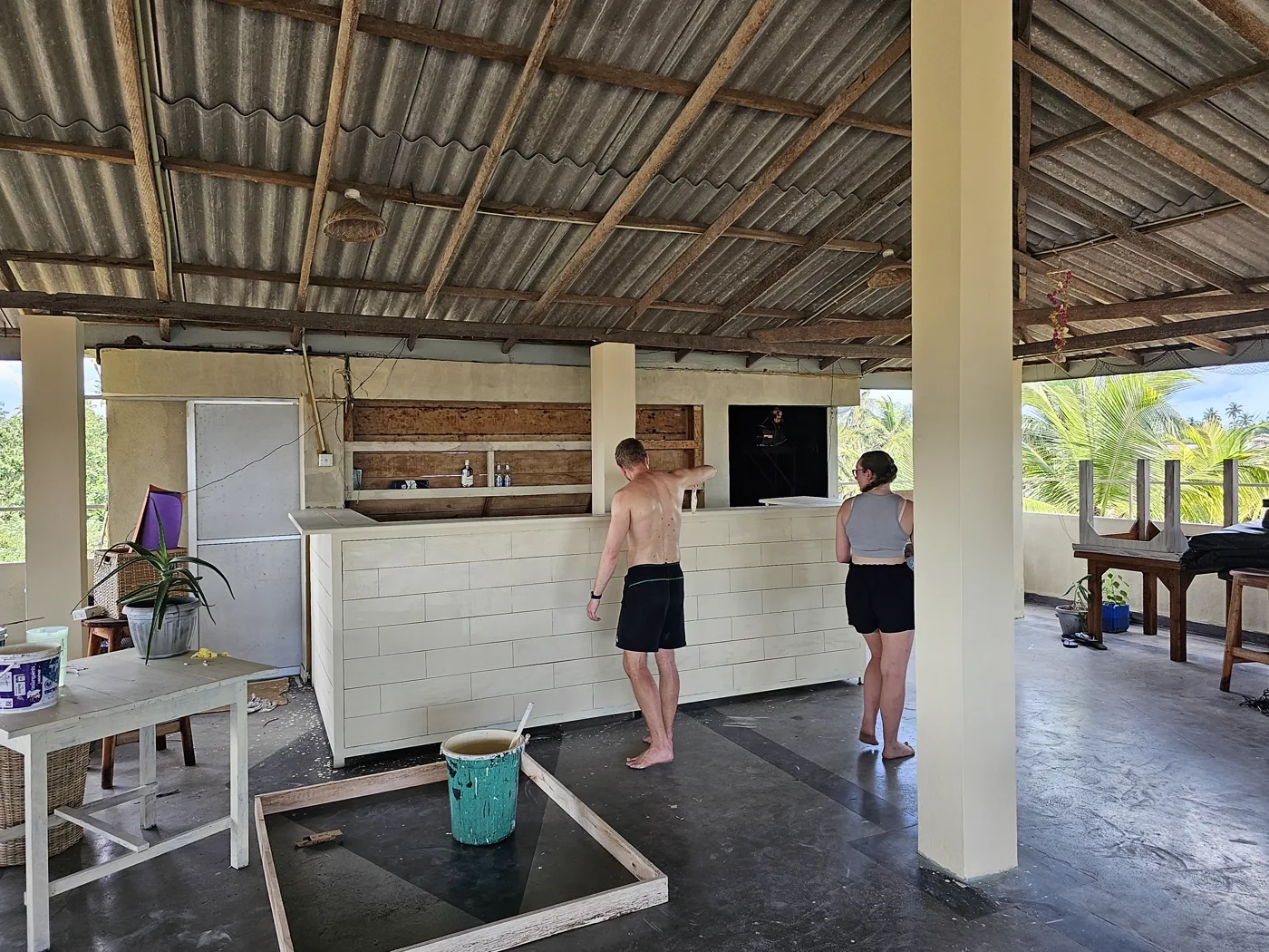 Volunteers building the rooftop social space at Sugar Hostel Weligama