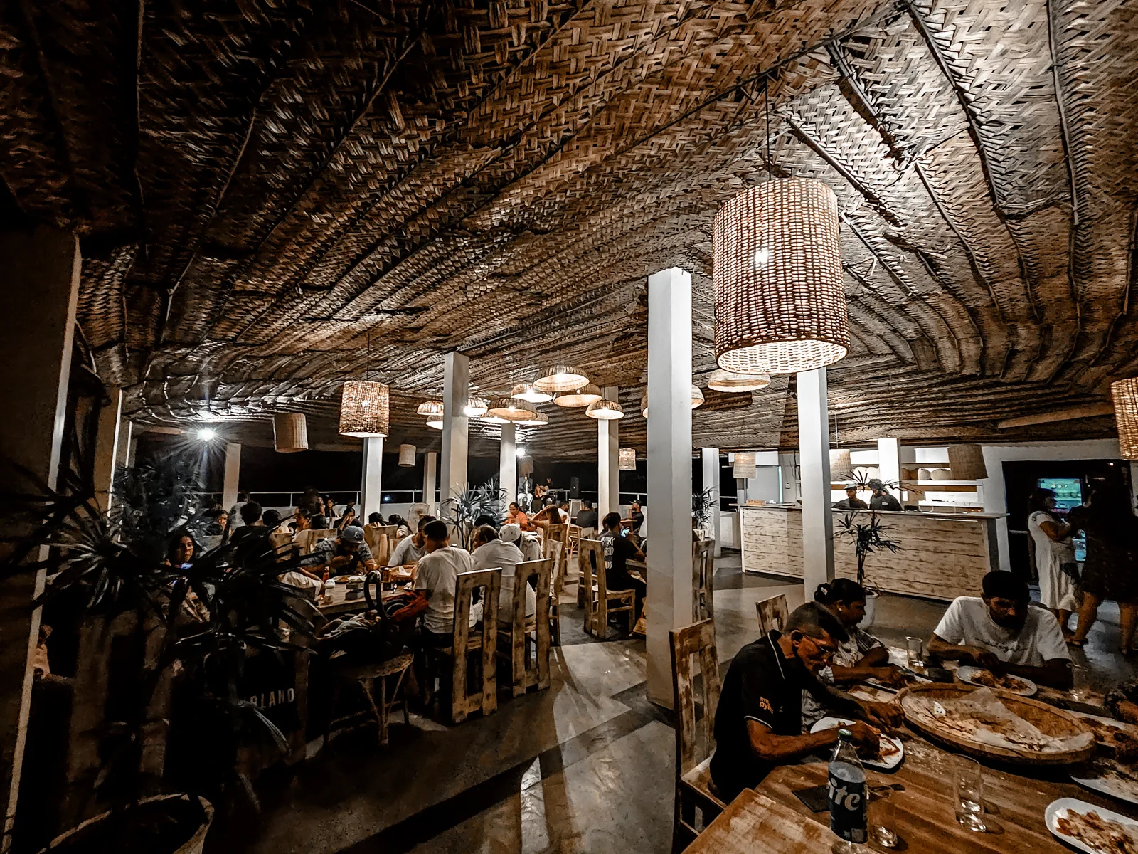 Guests dining together on the Sugar Hostel rooftop